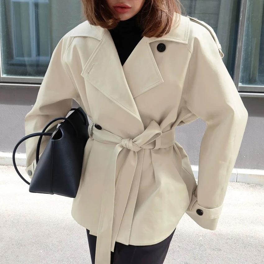 Women's Loose-Fit Trench Coat With Lapel Collar Defined Waist And Belt by GJG Denim