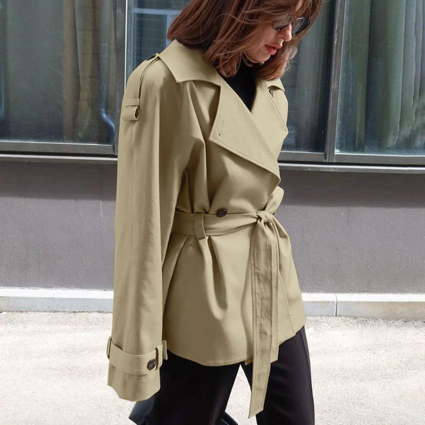 Women's Loose-Fit Trench Coat With Lapel Collar Defined Waist And Belt by GJG Denim