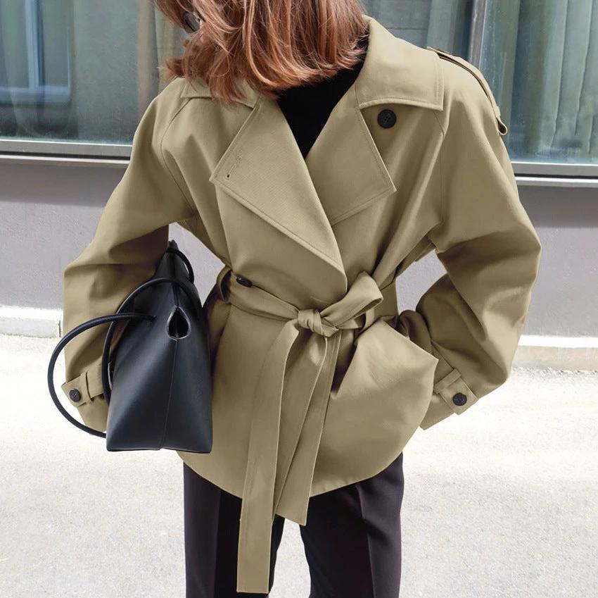 Women's Loose-Fit Trench Coat With Lapel Collar Defined Waist And Belt by GJG Denim